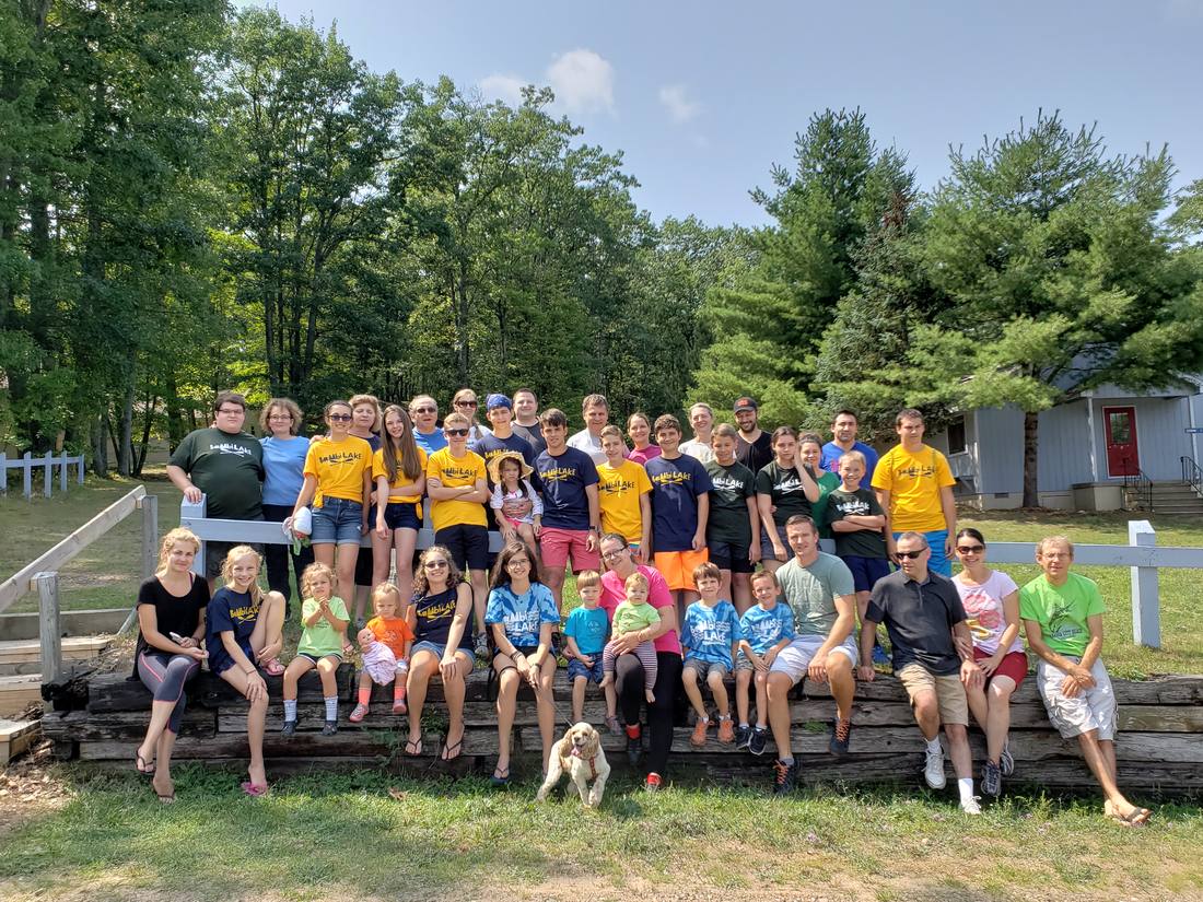 The Golgotha church family gathered outdoors at Bambi Lake Kids Camp